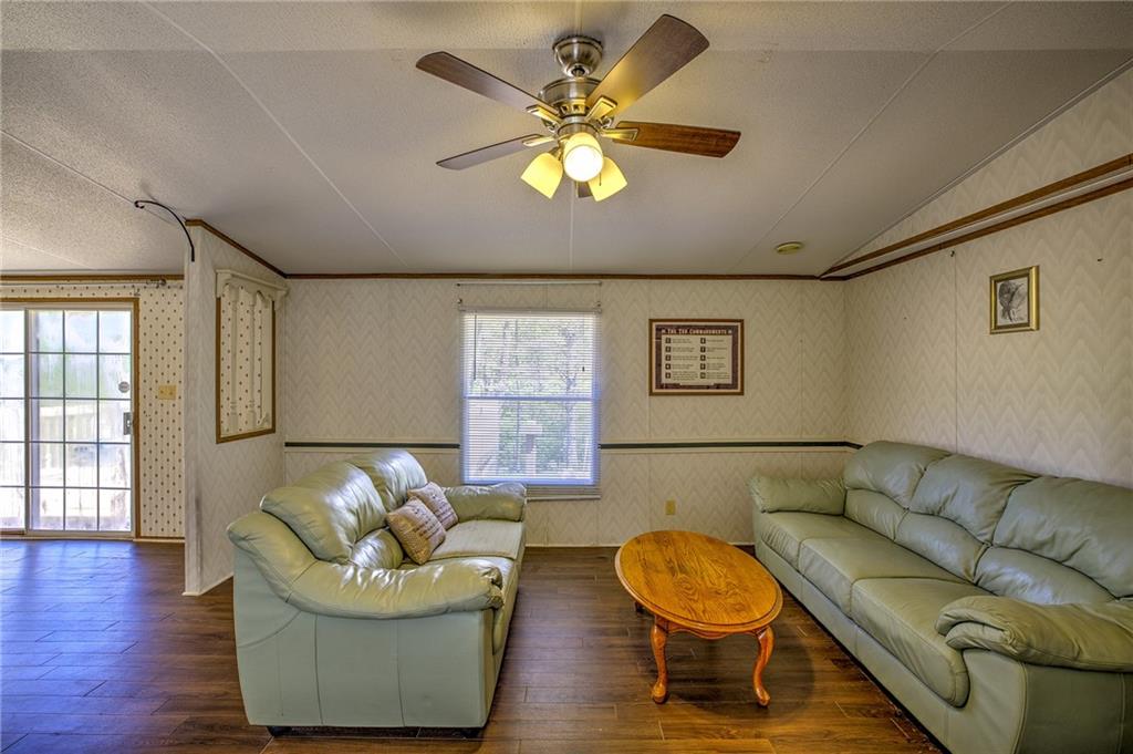 4201 Dunagan Road Gainesville, GA 30507 - Photo 14 of 37 a living room with furniture and a wooden floor
