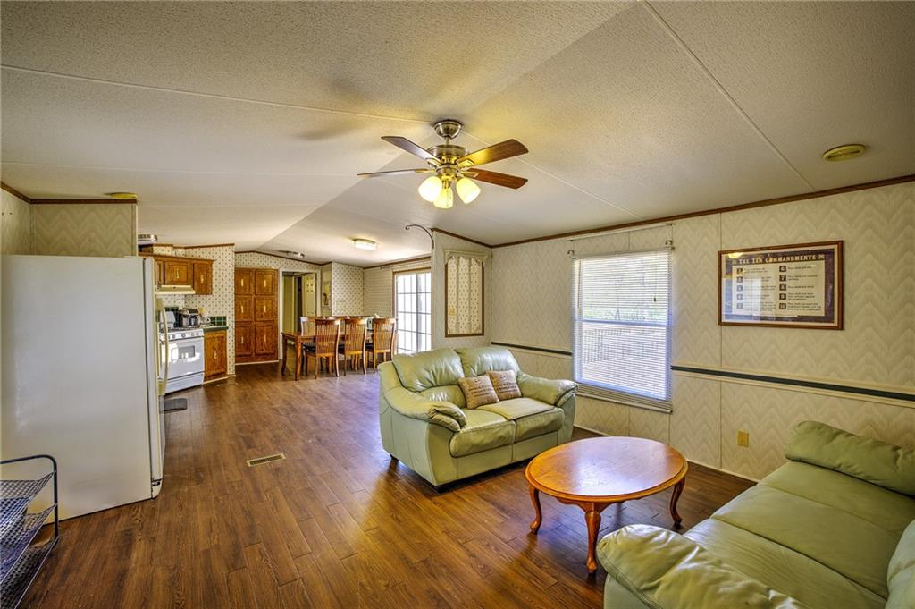 4201 Dunagan Road Gainesville, GA 30507 - Photo 15 of 37 a living room with furniture and wooden floor