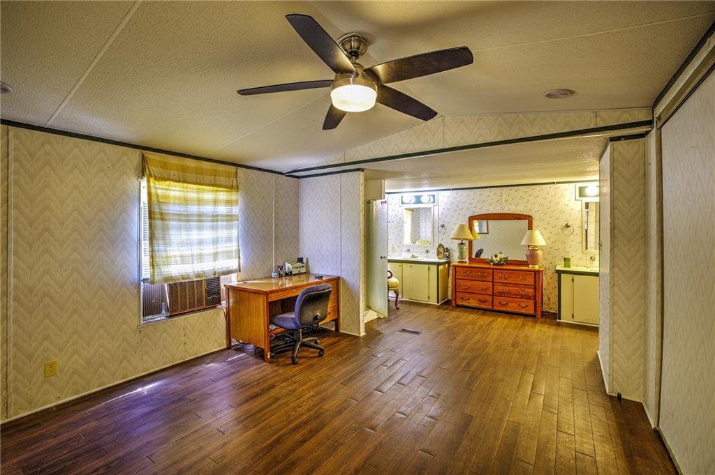 4201 Dunagan Road Gainesville, GA 30507 - Photo 20 of 37 a view of a room with wooden floor and furniture