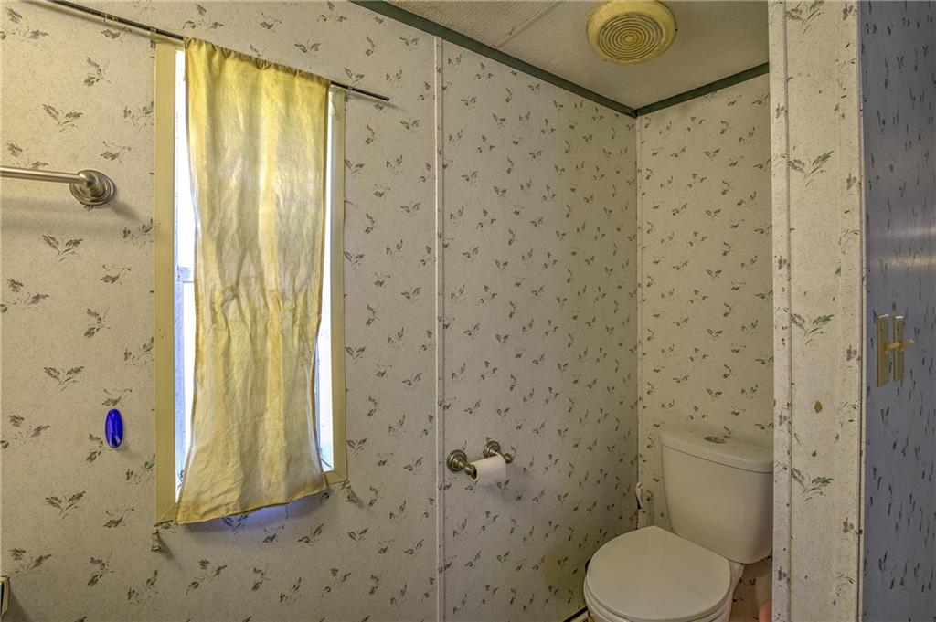 4201 Dunagan Road Gainesville, GA 30507 - Photo 23 of 37 a bathroom with a shower and a toilet sink