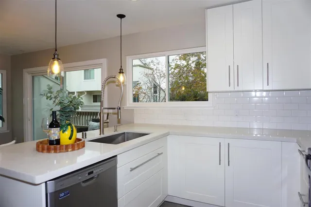 a kitchen with a sink and a window