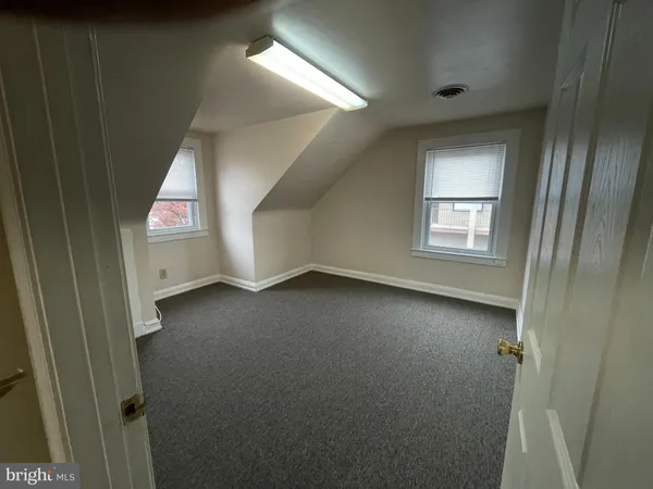 en empty room with windows