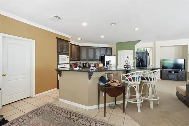 a view of a dining room kitchen and a window
