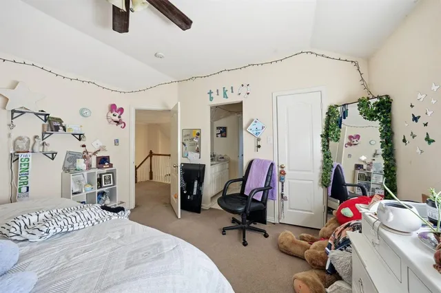 a bedroom with a workspace