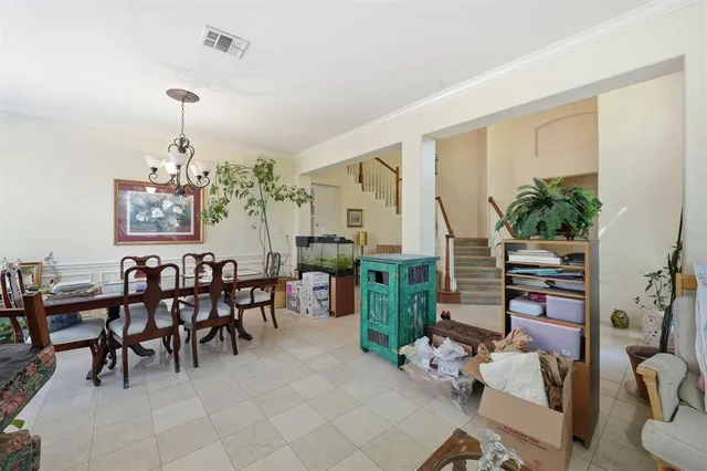 a dining room with furniture window and entryway
