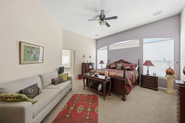 a bed room with furniture and a window