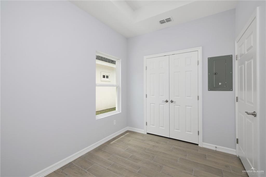412 East Acacia Avenue, Unit 1 Alamo, TX 78516 - Photo 17 of 22 a view of an empty room with closet and a window