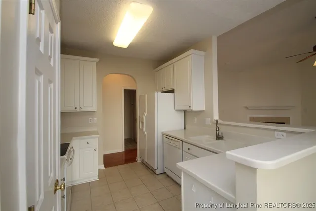 a view of a kitchen with a sink cabinets and a window