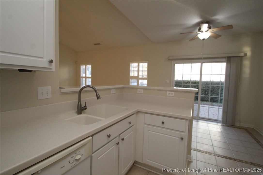 8508 Neuse Garden Drive Raleigh, NC 27616 - Photo 19 of 44 a kitchen with a sink and chandelier