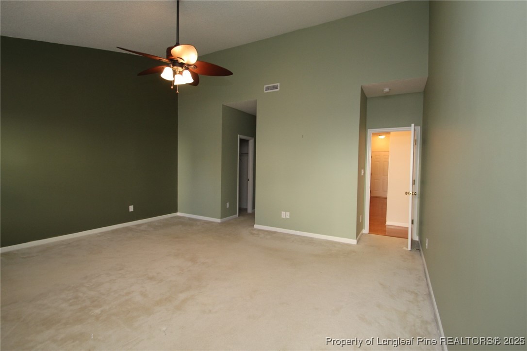 8508 Neuse Garden Drive Raleigh, NC 27616 - Photo 24 of 44 a view of an empty room with a chandelier fan