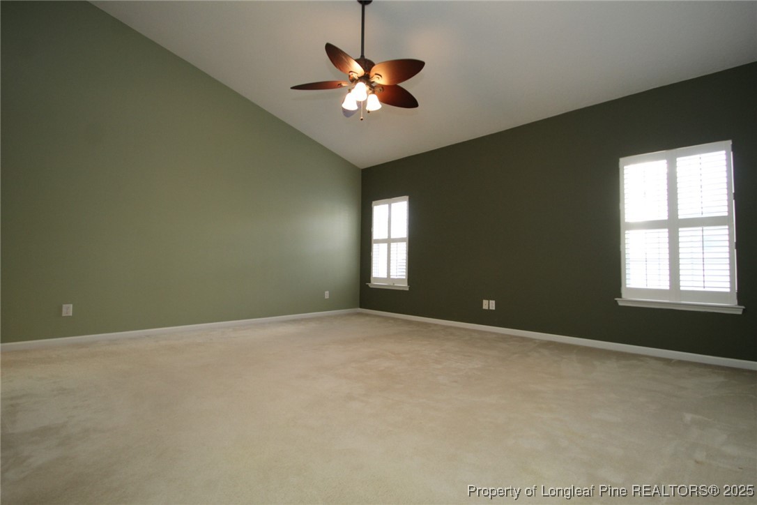 8508 Neuse Garden Drive Raleigh, NC 27616 - Photo 26 of 44 an empty room with a ceiling fan and window