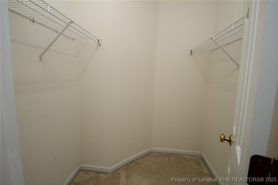 8508 Neuse Garden Drive Raleigh, NC 27616 - Photo 28 of 44 a view of a room with racks on the wall