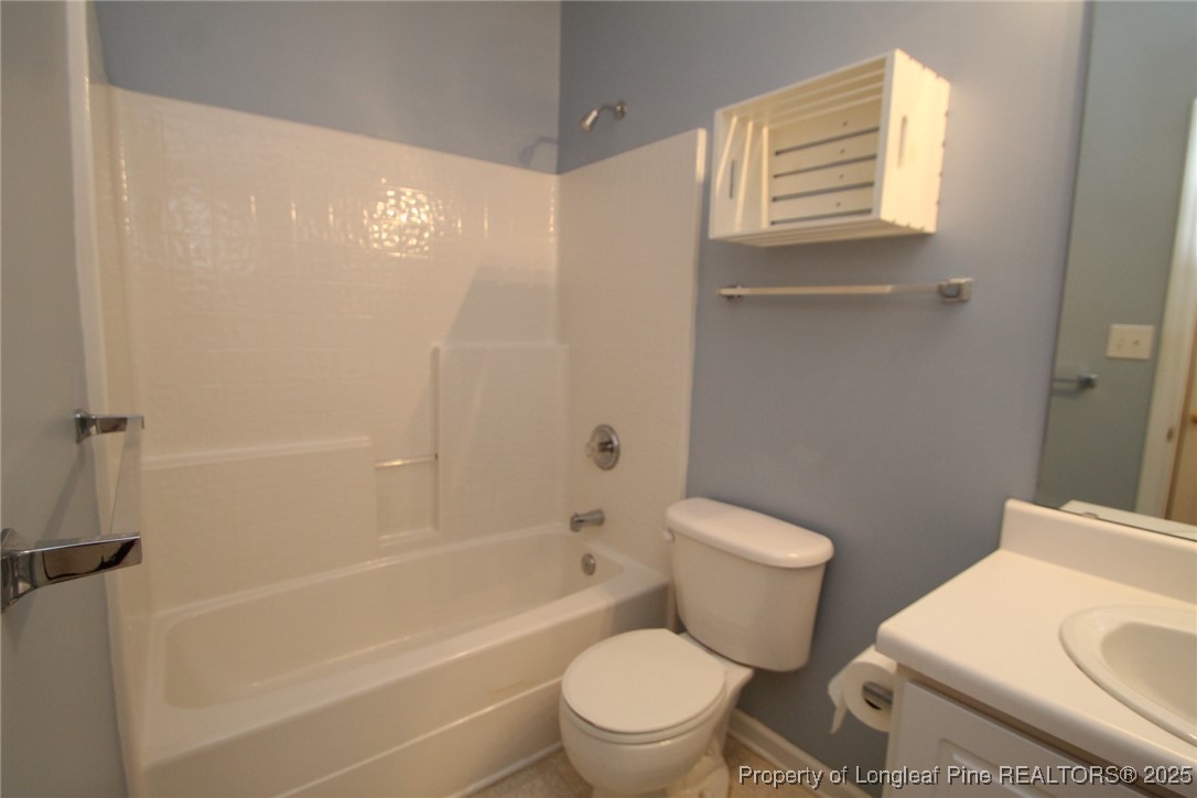 8508 Neuse Garden Drive Raleigh, NC 27616 - Photo 33 of 44 a white toilet sitting next to a bath tub