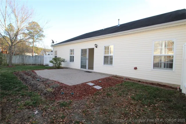 a view of a house with a yard and garage