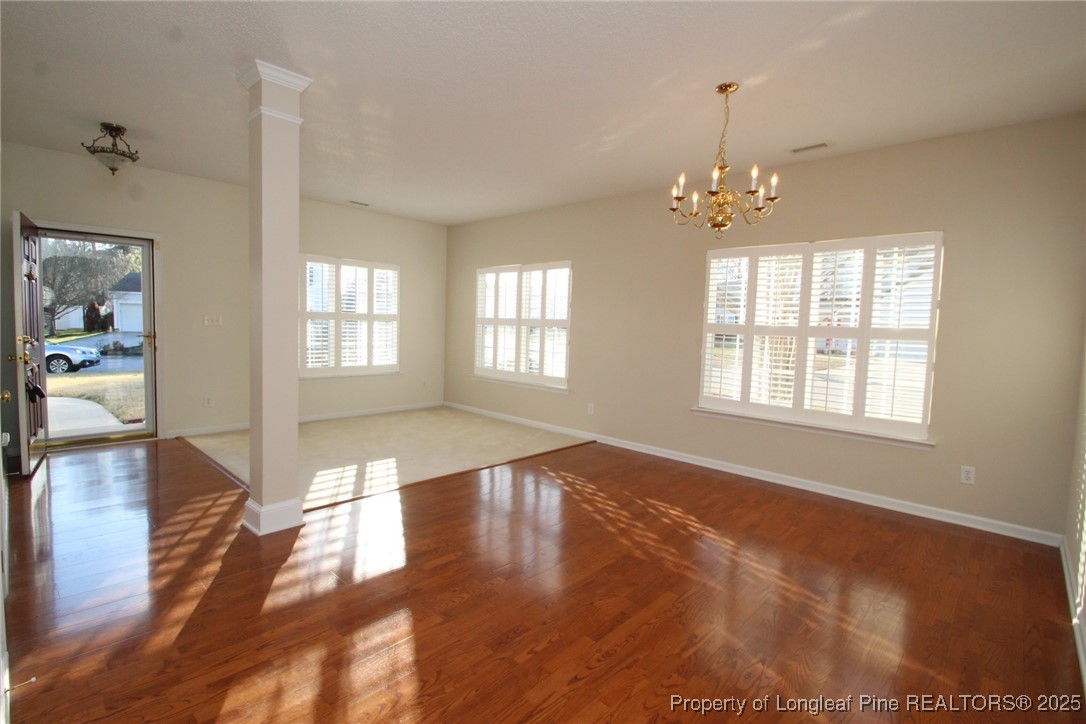 8508 Neuse Garden Drive Raleigh, NC 27616 - Photo 5 of 44 wooden floor in an empty room with a window