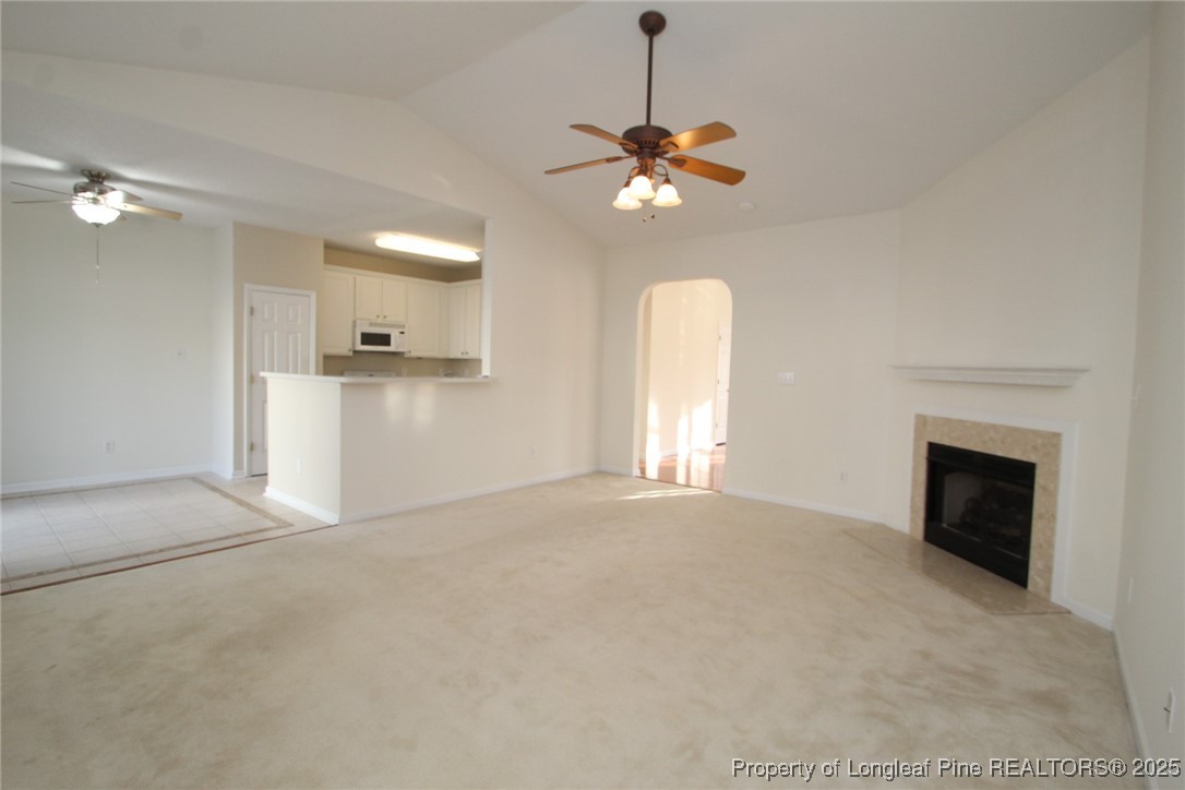 8508 Neuse Garden Drive Raleigh, NC 27616 - Photo 9 of 44 a view of an empty room with a fireplace and a window