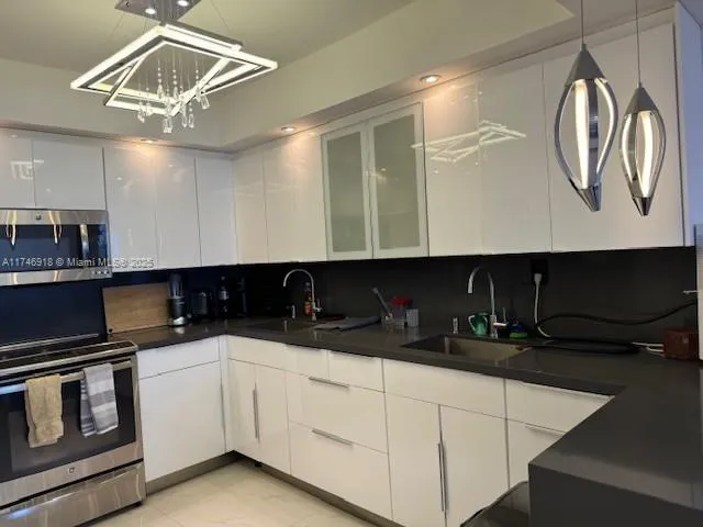 a kitchen with a sink and cabinets