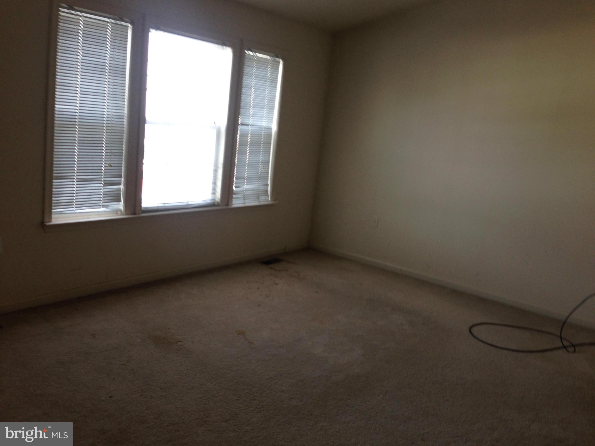 112 Estate Lane Ranson, WV 25438 - Photo 8 of 12 an empty room with a window