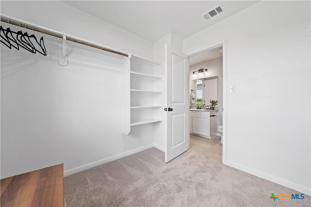 723 Meiomi Drive Temple, TX 76502 - Photo 12 of 19 a view of a kitchen with white cabinets and a sink