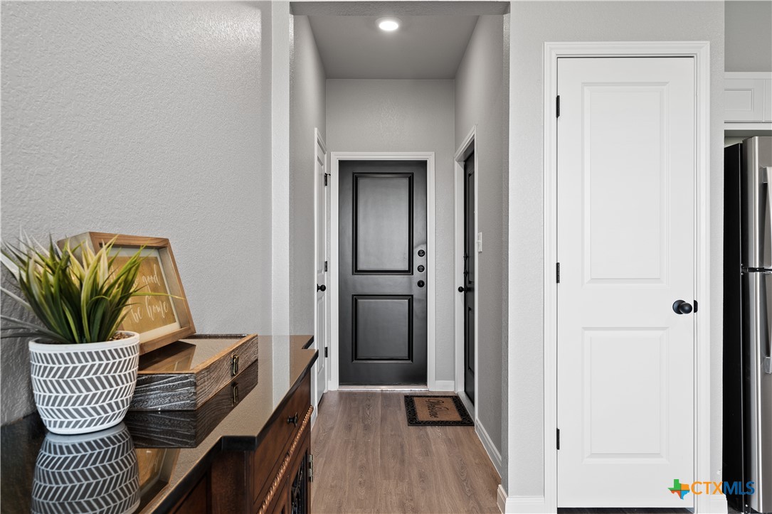 723 Meiomi Drive Temple, TX 76502 - Photo 3 of 19 a view of hallway with furniture and a potted plant
