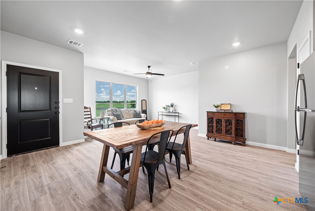 723 Meiomi Drive Temple, TX 76502 - Photo 5 of 19 a view of a dining room with furniture window and wooden floor