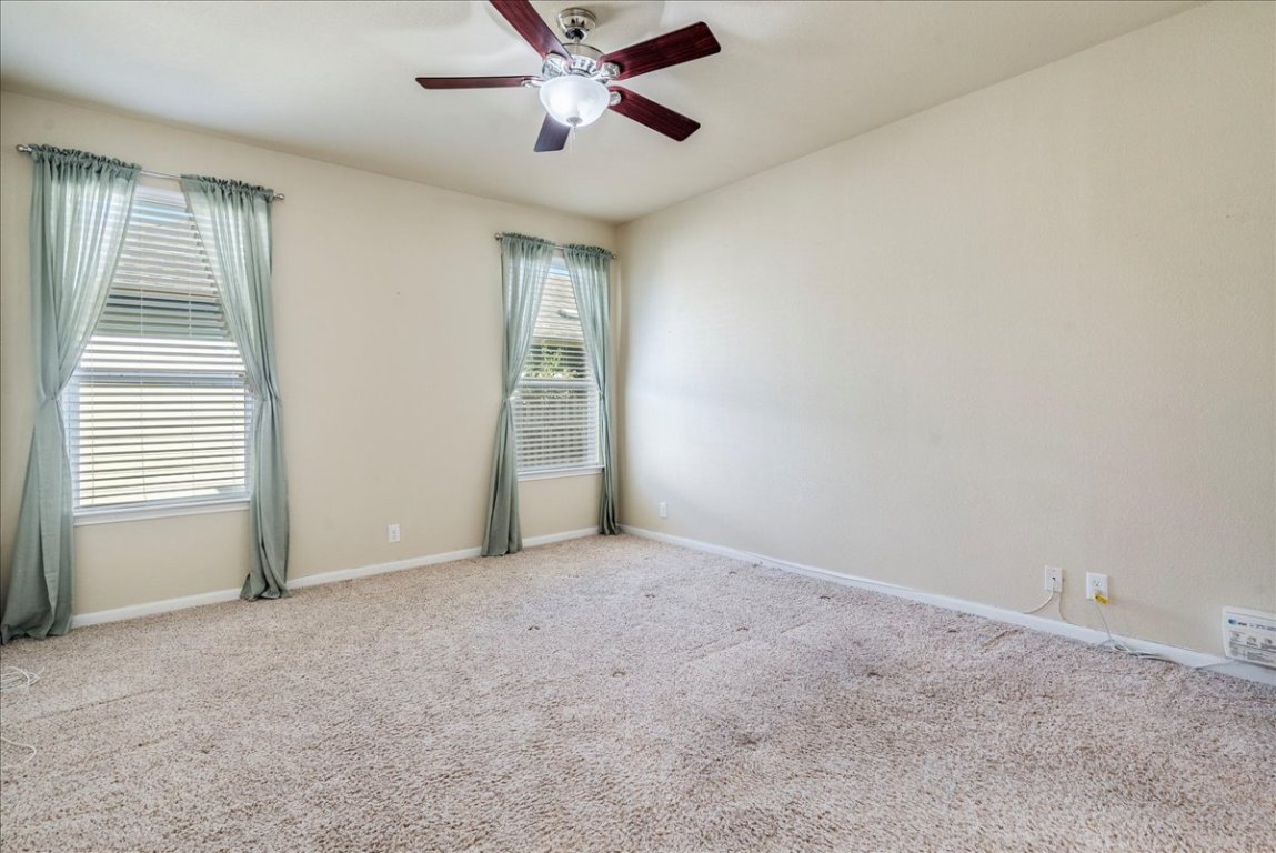 512 Lookout Tree Lane Round Rock, TX 78664 - Photo 12 of 29 Empty room featuring carpet and ceiling fan
