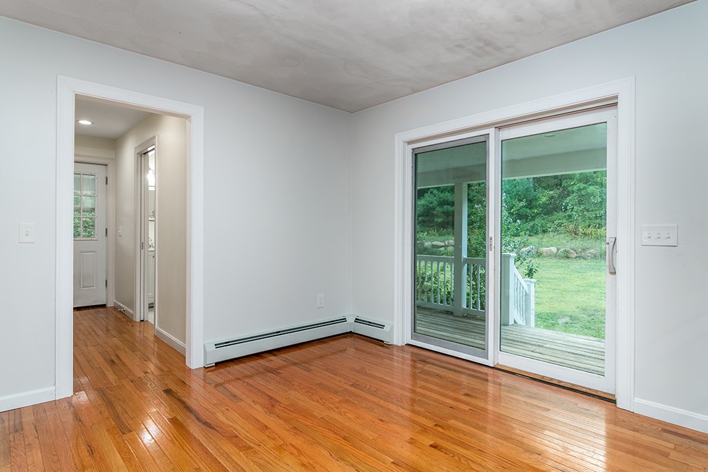 1 Bridgeview Drive Richmond, RI 02892 - Photo 14 of 34 Kitchen to entry hall and door to wraparound farmers porch