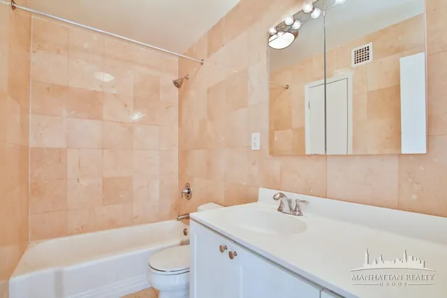 a bathroom with a sink a toilet and a bathtub