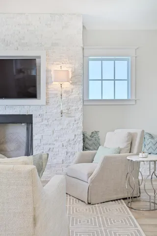 a kitchen with a sink and white cabinets