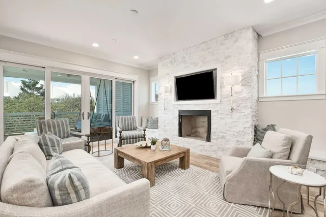 a bedroom with a large bed and a flat tv screen on dresser