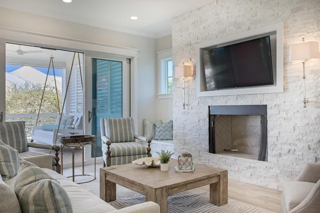 a living room with furniture and a lamp
