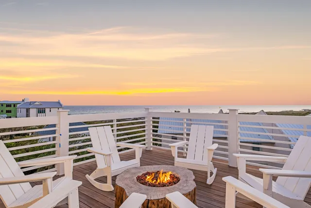 a view of a white house with large windows