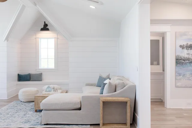 a bedroom with a bed and flat screen tv