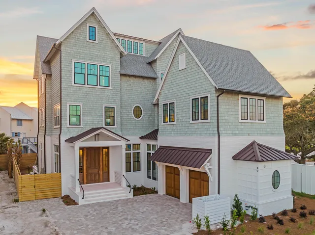 an aerial view of residential building with outdoor space and lake view
