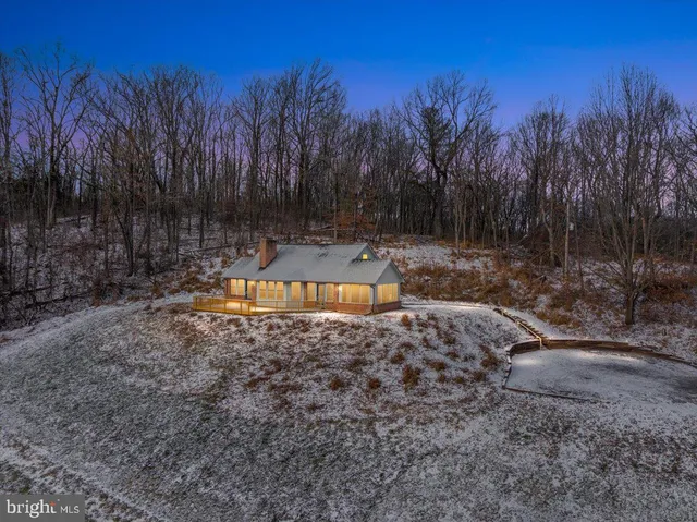 a kitchen with stainless steel appliances granite countertop a sink dishwasher stove and cabinets with wooden floor
