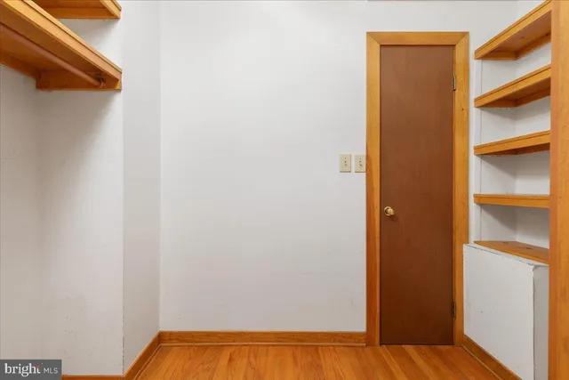 a view of balcony with wooden floor and fence
