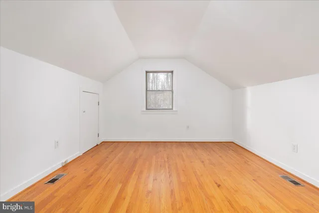 a front view of a house with a wooden fence