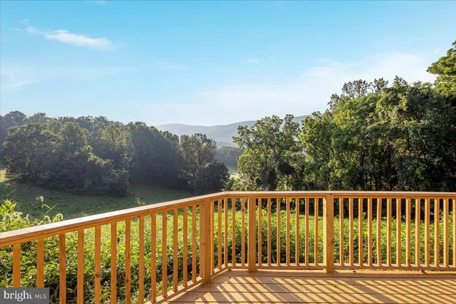 a view of a house with a yard and covered with snow