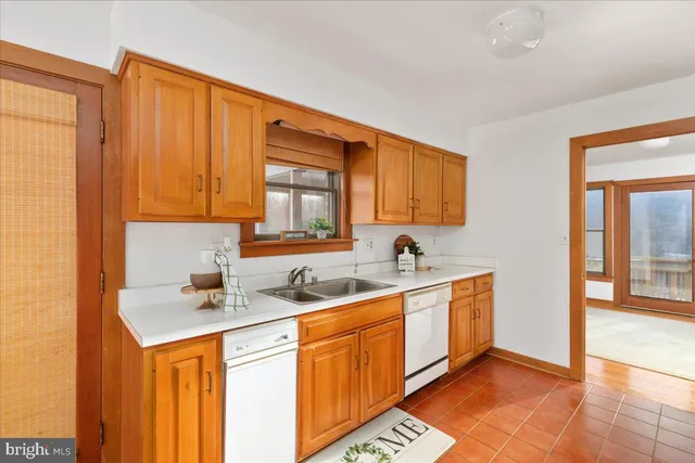 a kitchen with a refrigerator sink stove and cabinets