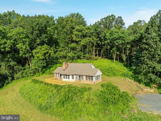 a view of a yard with mountains in the background