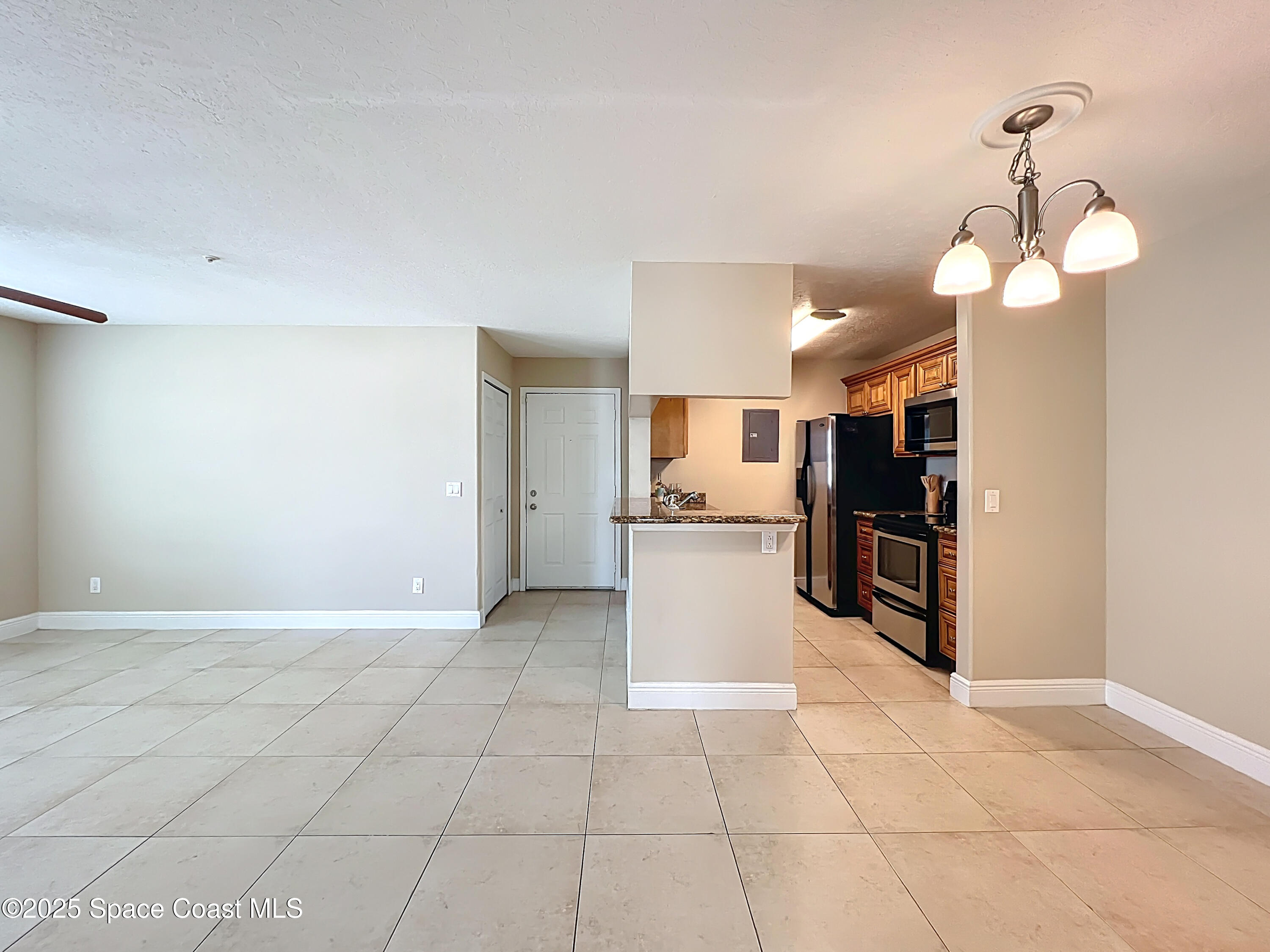 7667 North Wickham Road, Unit 410 Melbourne, FL 32940 - Photo 13 of 37 a view of a kitchen with a sink and dishwasher kitchen view