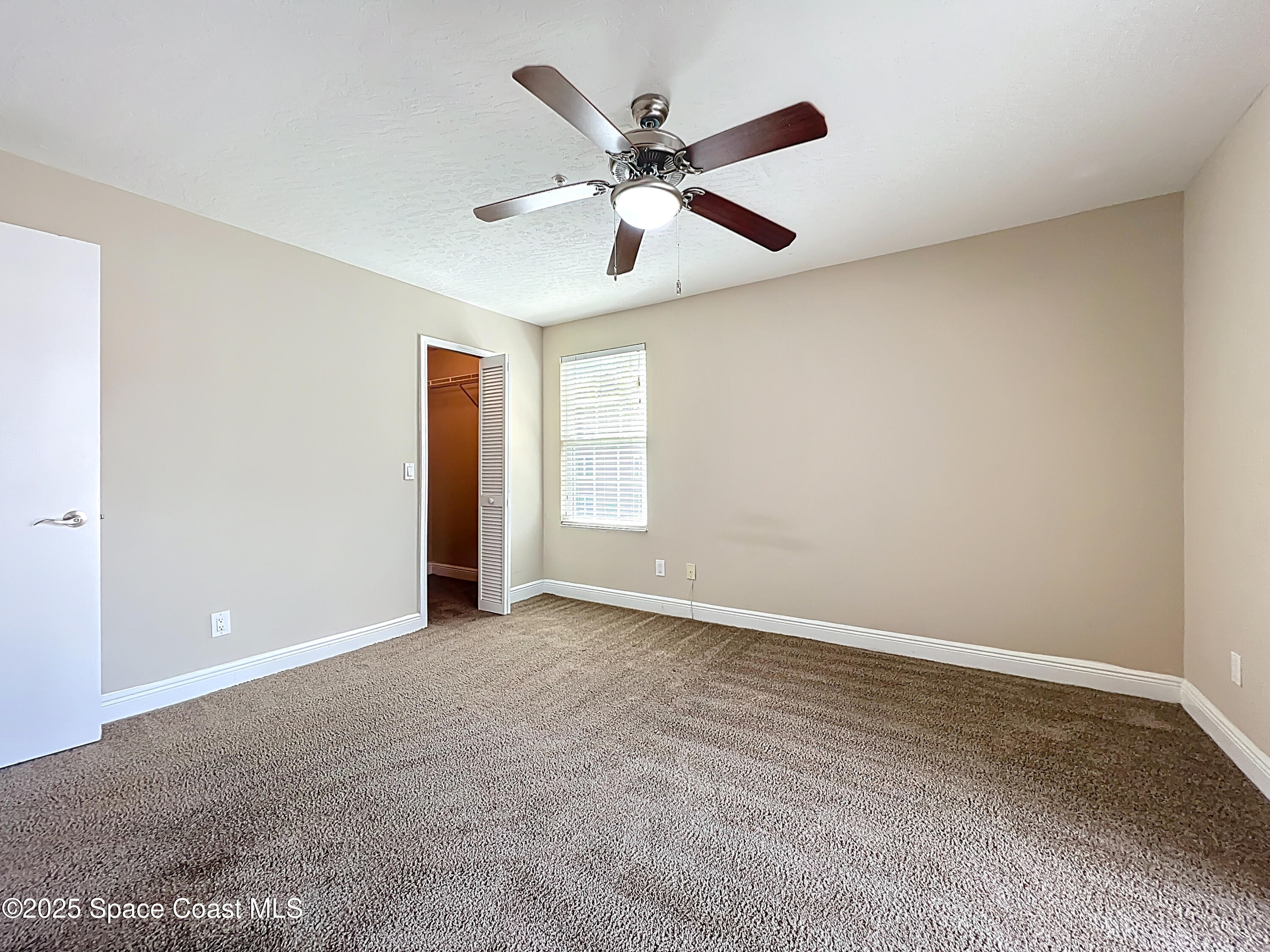 7667 North Wickham Road, Unit 410 Melbourne, FL 32940 - Photo 16 of 37 a view of an empty room