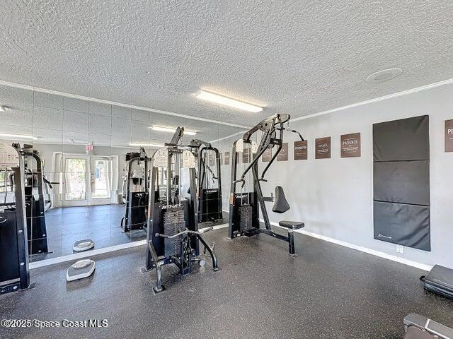 7667 North Wickham Road, Unit 410 Melbourne, FL 32940 - Photo 30 of 37 a view of a room with gym equipment