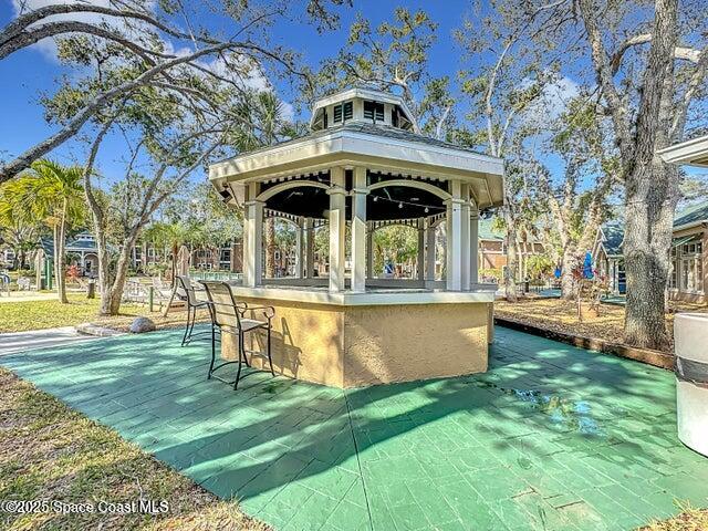 7667 North Wickham Road, Unit 410 Melbourne, FL 32940 - Photo 35 of 37 a view of a house with a yard
