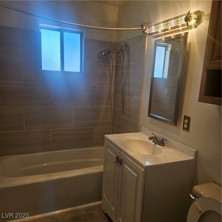 350 East Desert Inn Road, Unit C203 Las Vegas, NV 89109 - Photo 16 of 35 Full bathroom featuring plenty of natural light, washtub / shower combination, and vanity