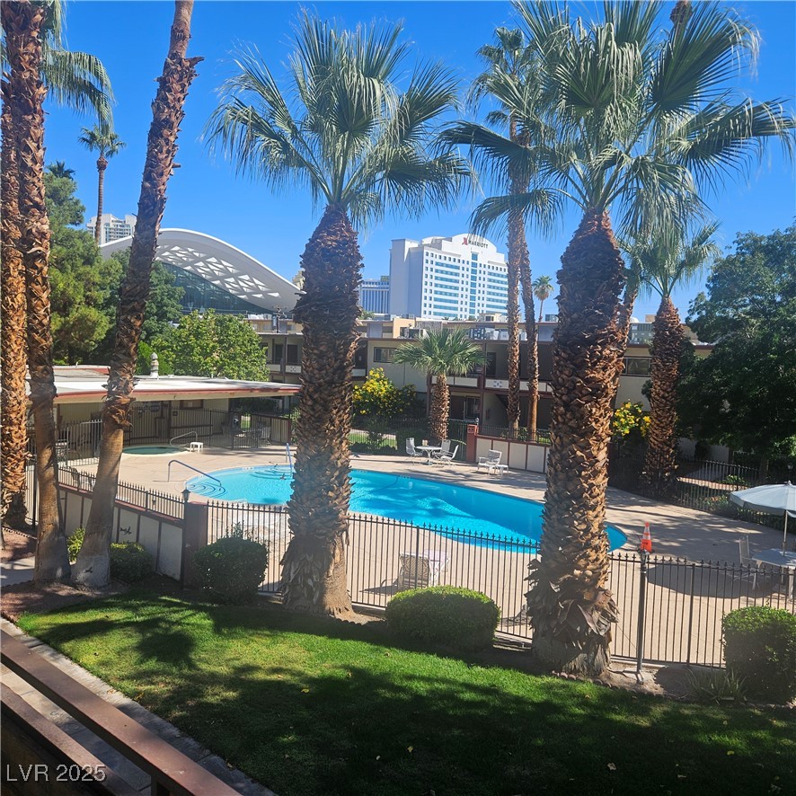 350 East Desert Inn Road, Unit C203 Las Vegas, NV 89109 - Photo 3 of 35 Community pool featuring a patio