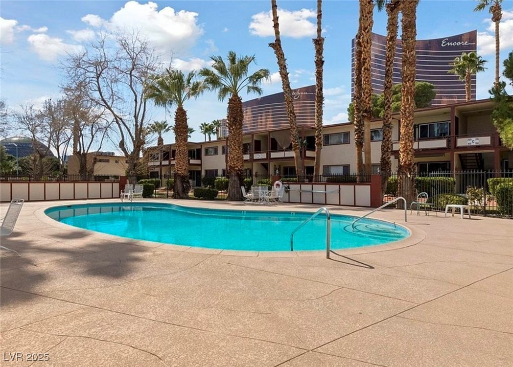 350 East Desert Inn Road, Unit C203 Las Vegas, NV 89109 - Photo 31 of 35 Community pool with a patio