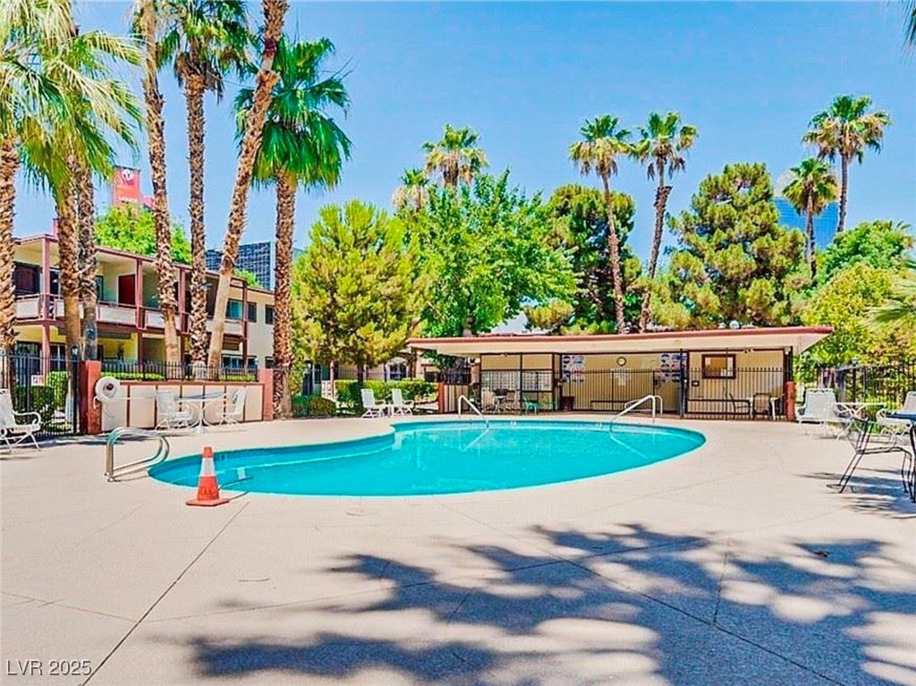 350 East Desert Inn Road, Unit C203 Las Vegas, NV 89109 - Photo 32 of 35 Community pool with a patio area