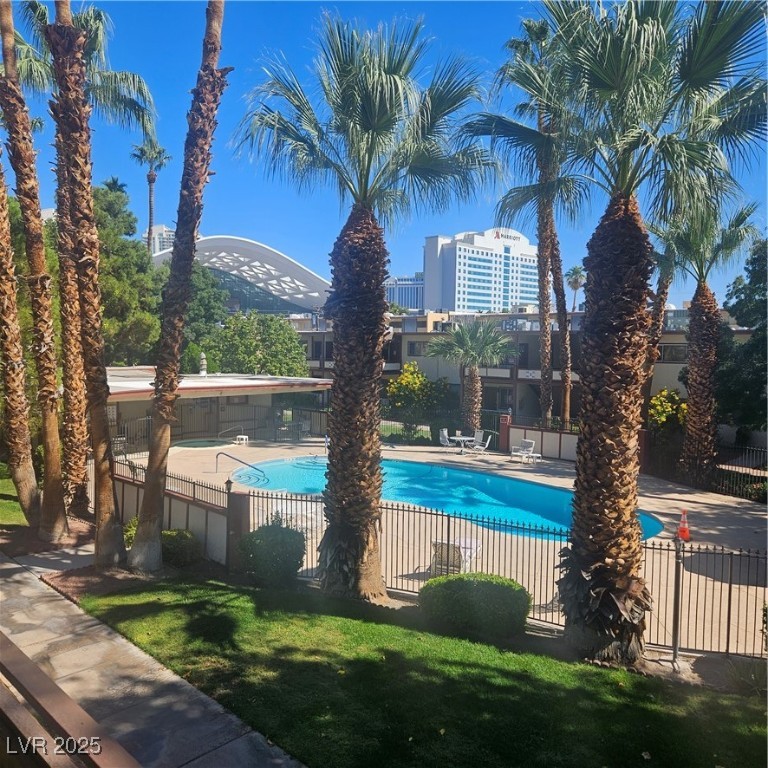 350 East Desert Inn Road, Unit C203 Las Vegas, NV 89109 - Photo 33 of 35 Community pool featuring a patio