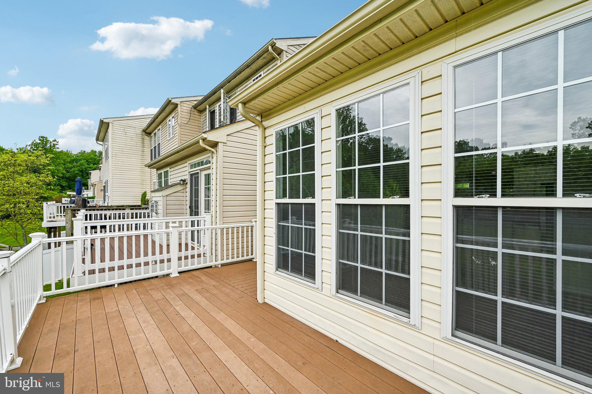 1461 Pangbourne Way Hanover, MD 21076 - Photo 13 of 51 a view of a balcony with a large window and wooden floor